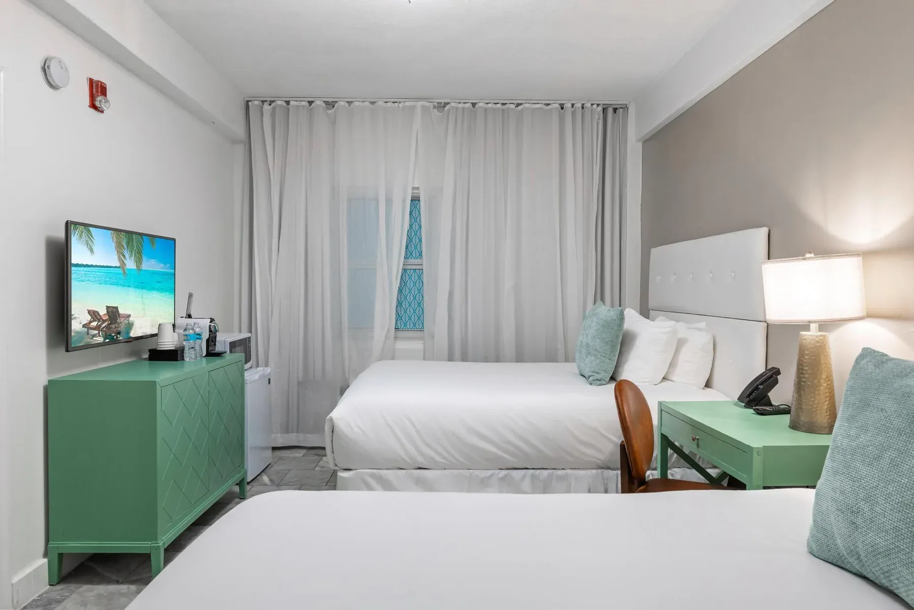 Accessible Double, two double beds with the television and dresser opposite