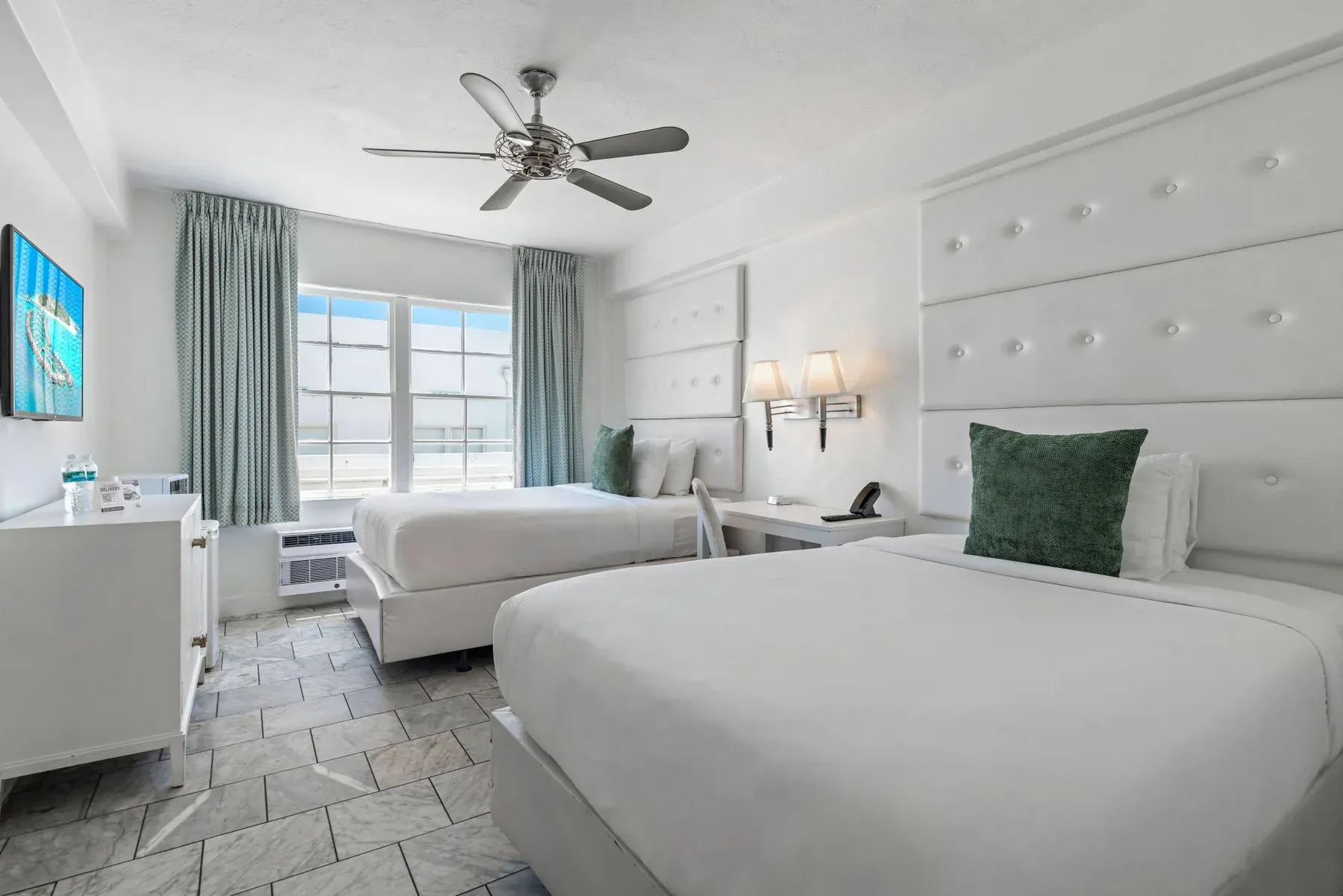 Deluxe Double Room seen from the door, two double beds and the windows beyond
