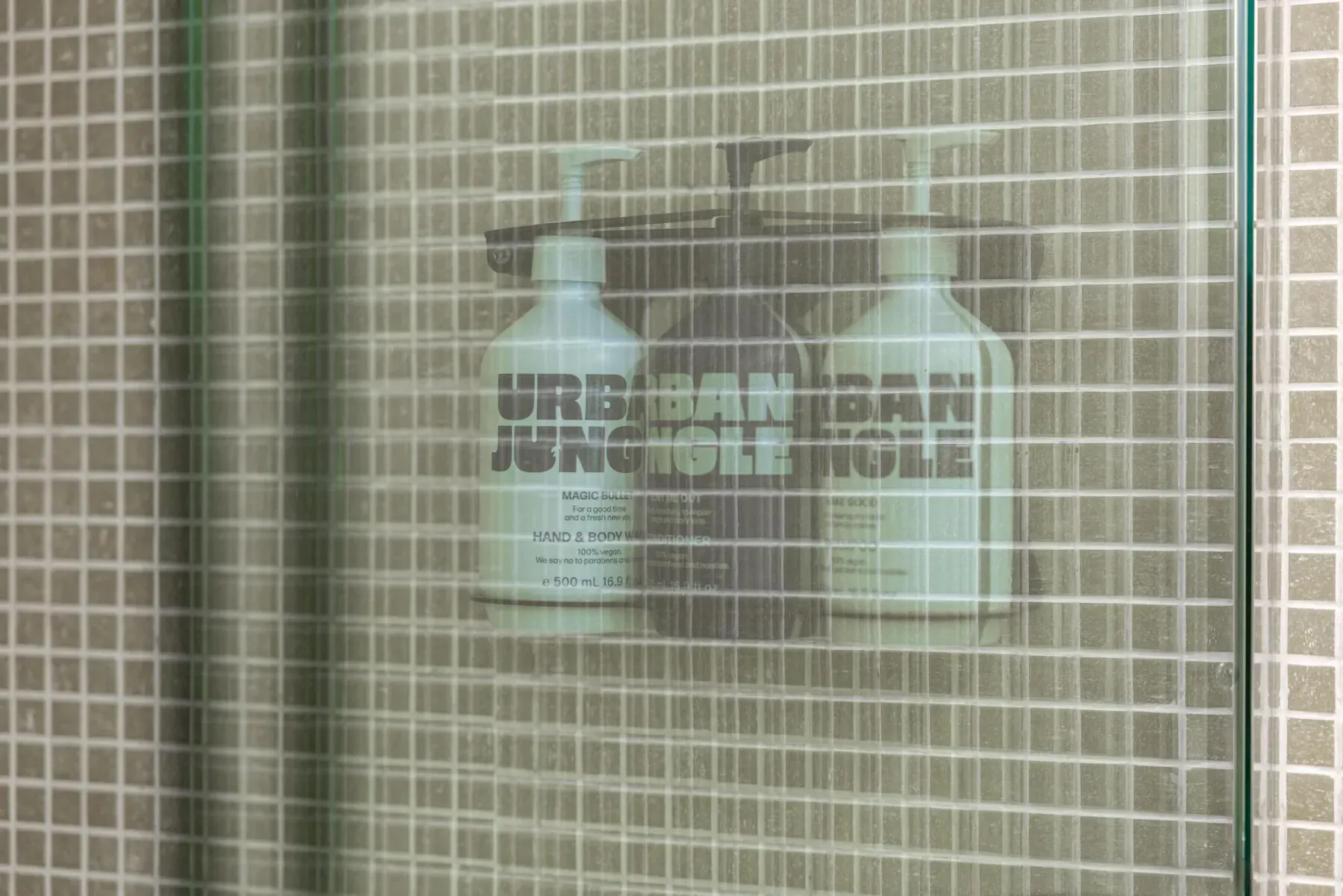 Bath products on the tiled shower shelf