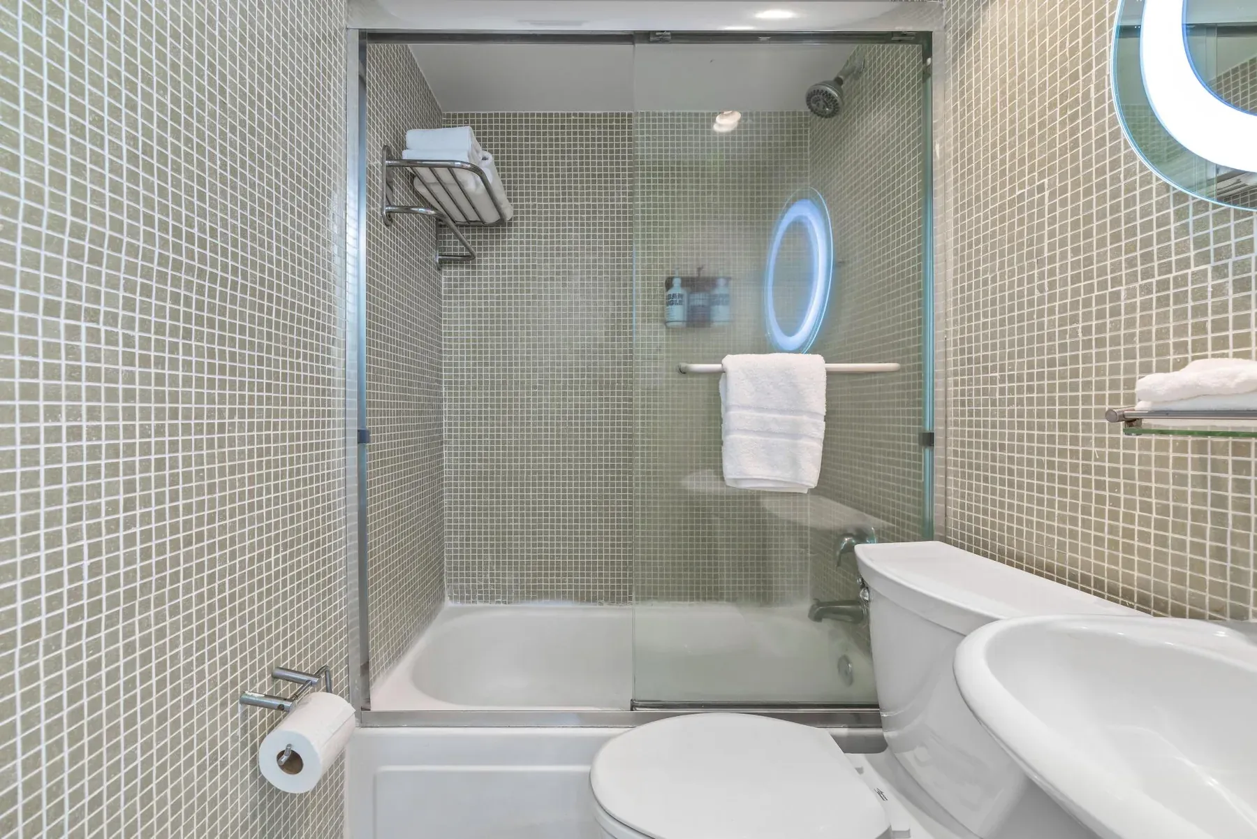 The bath and glass screen beside the basin