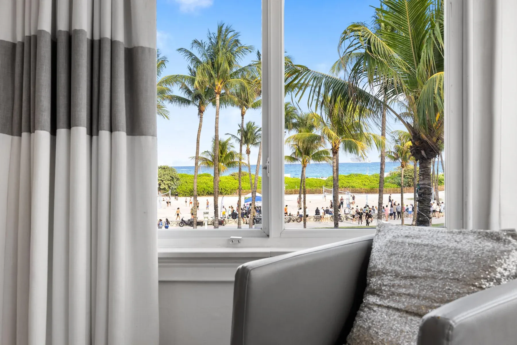 The view from the suite window, palm trees, the beach and the Atlantic beyond